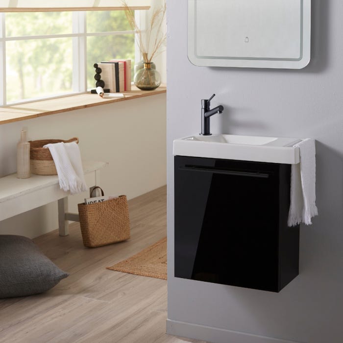 Meuble pour wc laqué noir avec lave-mains équipé d'un porte serviette en céramique et mitigeur noir